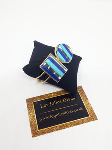 women gold and blue bracelet